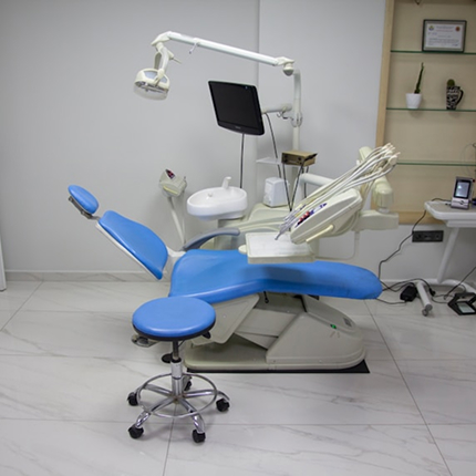 Dental Procedure - Dentist performing a dental procedure using advanced technology
